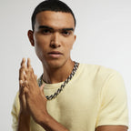 A man wearing a black Cuban link chain