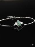 WRAPGAME INDIA silver chain bracelet with a green and white jeweled bee charm. Adjustable chain.