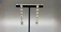 WRAPGAME INDIA Heart Diamonte Sleek Earrings with AAA cubic zirconia stones and emerald-cut drop.