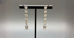 WRAPGAME INDIA Heart Diamonte Sleek Earrings with AAA cubic zirconia stones and emerald-cut drop.