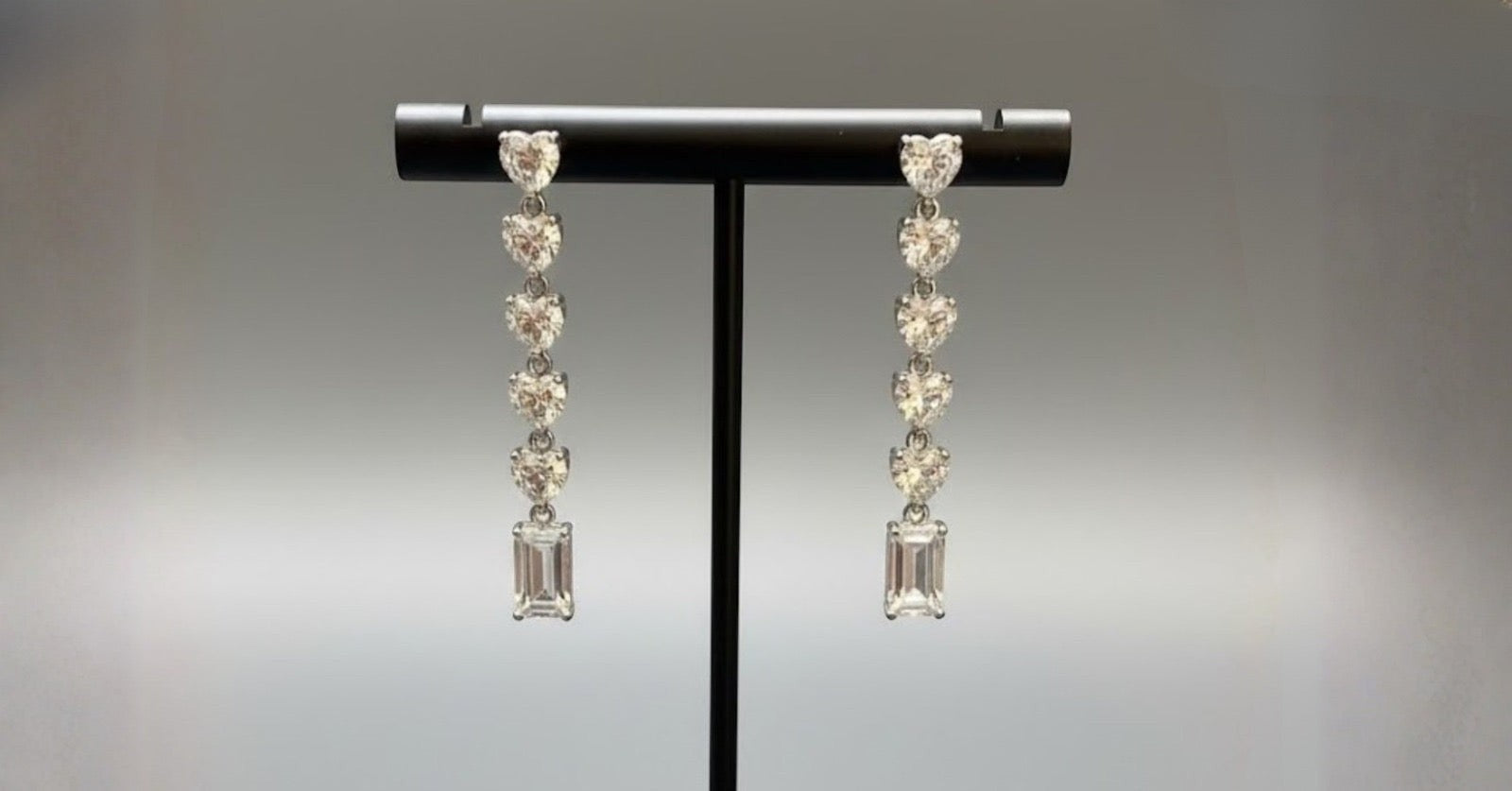 WRAPGAME INDIA Heart Diamonte Sleek Earrings with AAA cubic zirconia stones and emerald-cut drop.