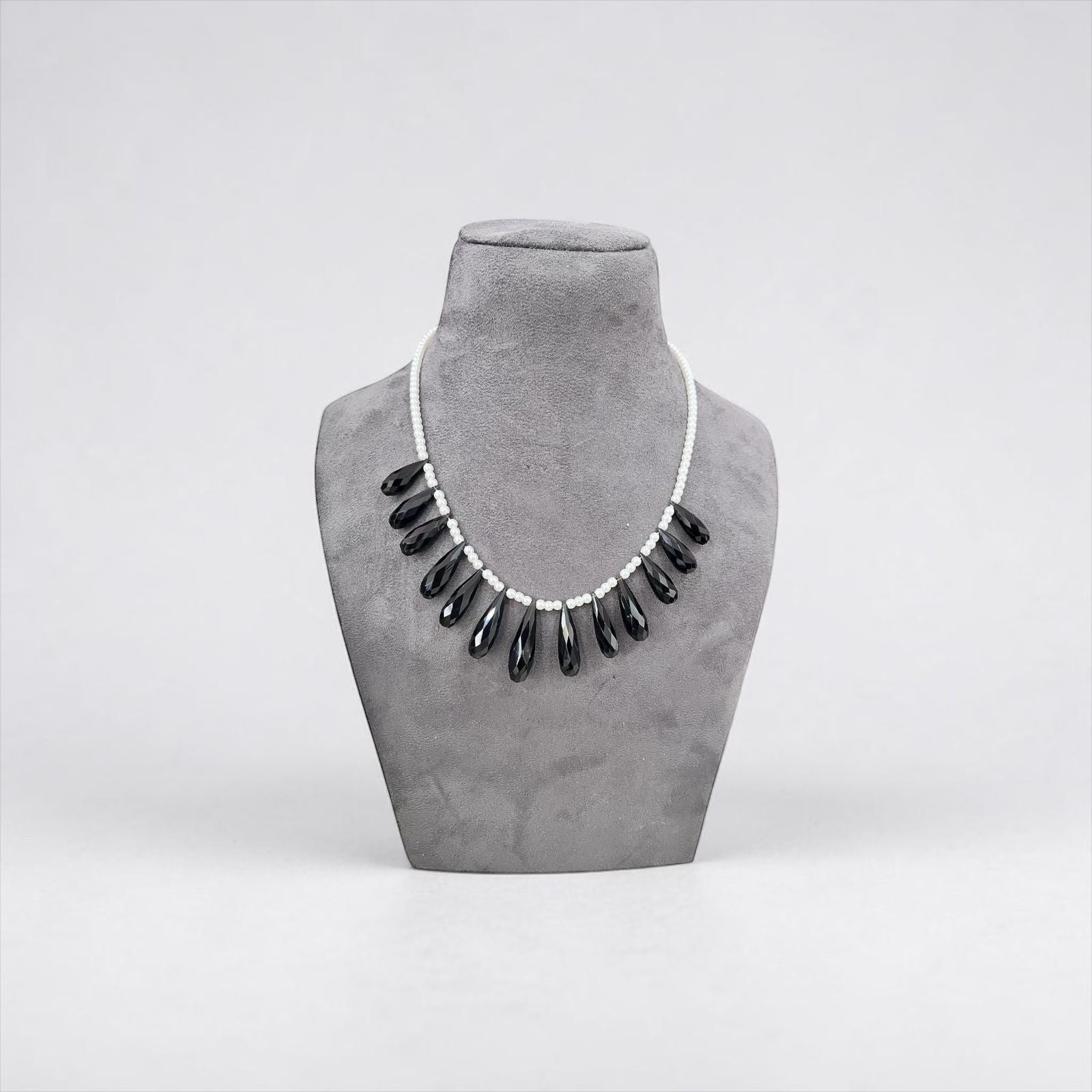 WRAPGAME INDIA Pearl Drop Chain necklace with black onyx teardrops and white pearls. Modern elegance.